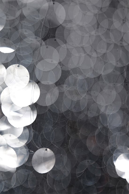 PRADA cappotto in tessuto tecnico decorato con paillettes 2025