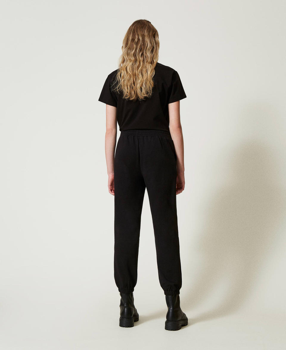 Twin Set Pantaloni joggers in felpa con raso Acquista Ora